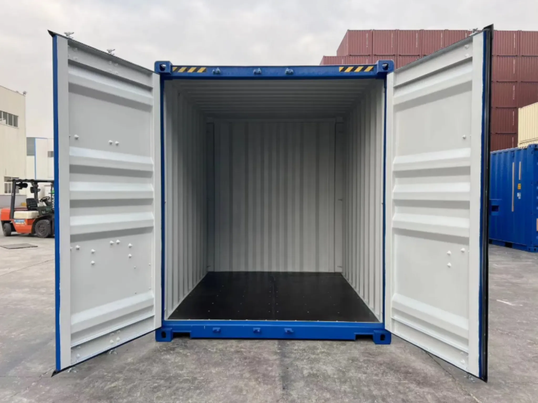 10ft new one trip high cube shipping container in blue — interior view showing wind and watertight steel storage with secure double doors, available UK-wide.