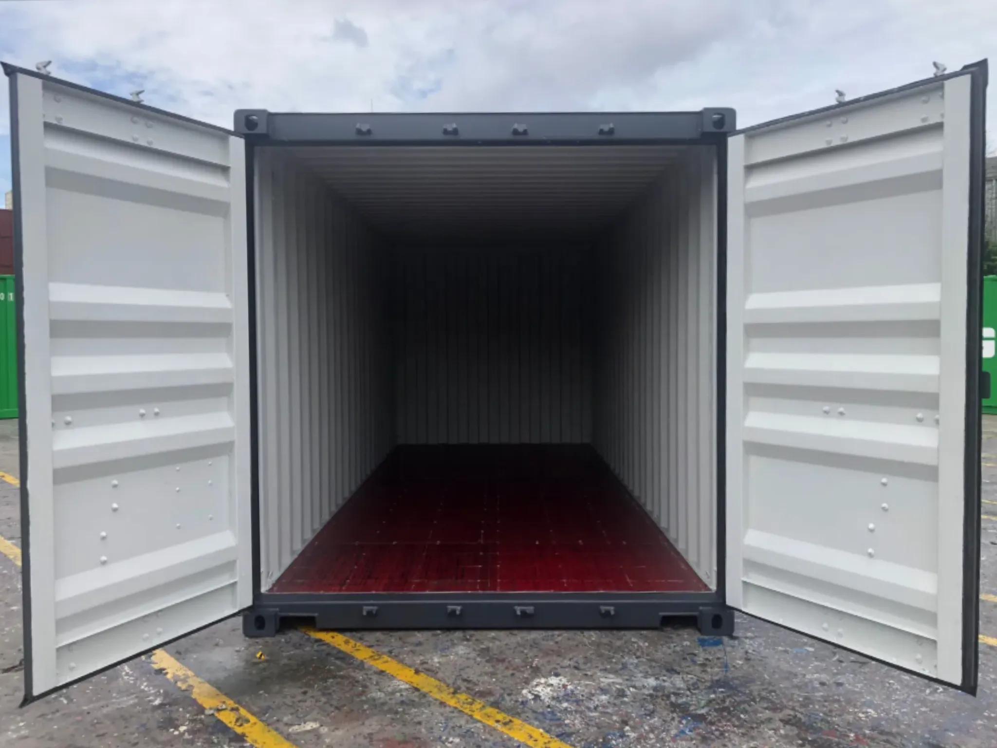 20ft new one trip shipping container — open double doors showing clean red flooring, ideal for archive storage, tools or temporary site equipment, UK delivery.