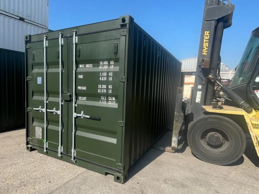 20ft shipping container moved by forklift on delivery yard