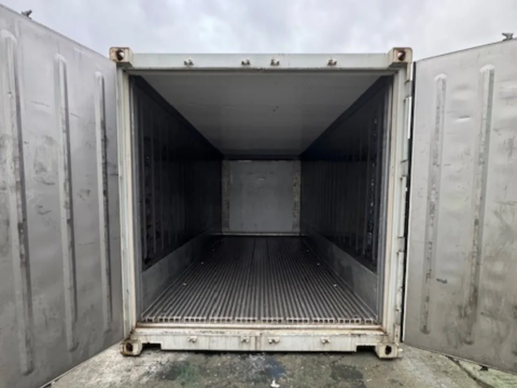 Interior of 20ft used marine reefer container with doors open, showing insulated walls and T-section aluminium floor