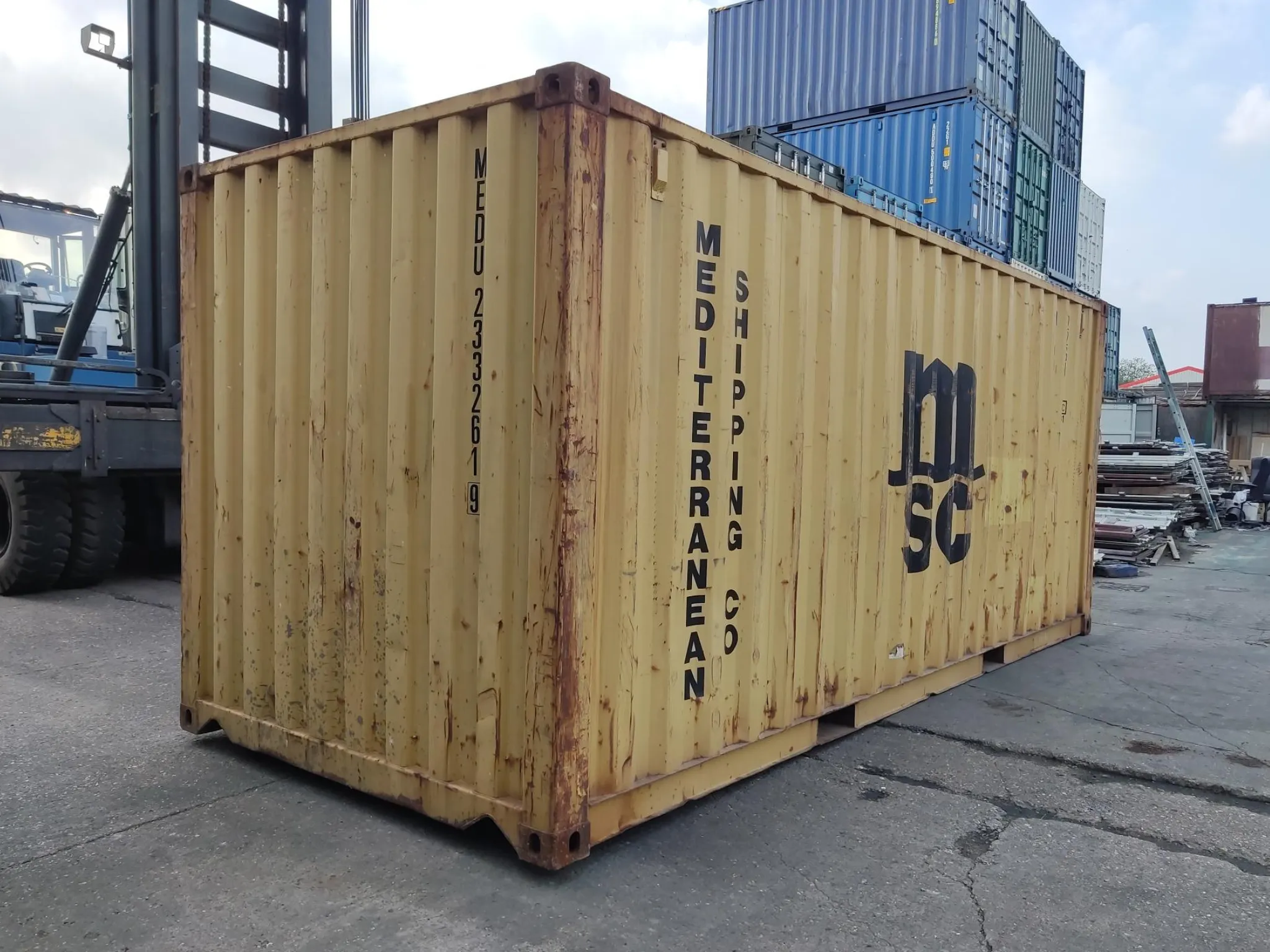 20ft used shipping container in yellow — ex-fleet steel unit with visible wear, ideal for budget storage, site use or farm equipment storage, UK-wide.