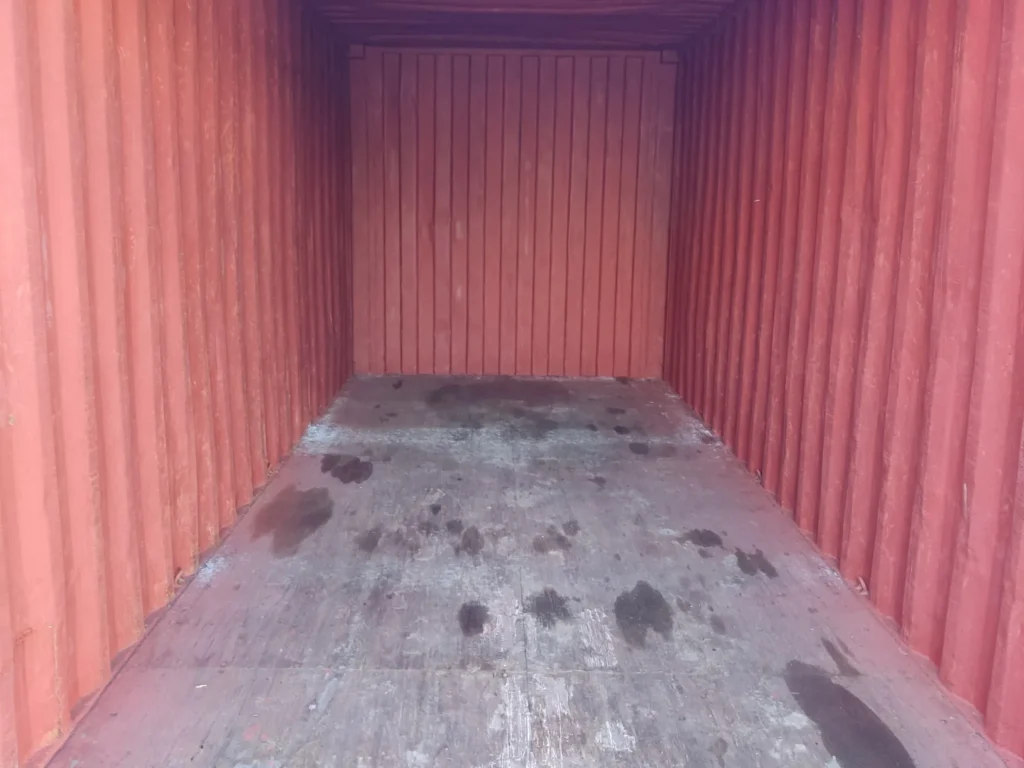 20ft used shipping container interior — ex-fleet steel unit with wooden flooring, ideal for affordable storage, site workshops or farm equipment across the UK.