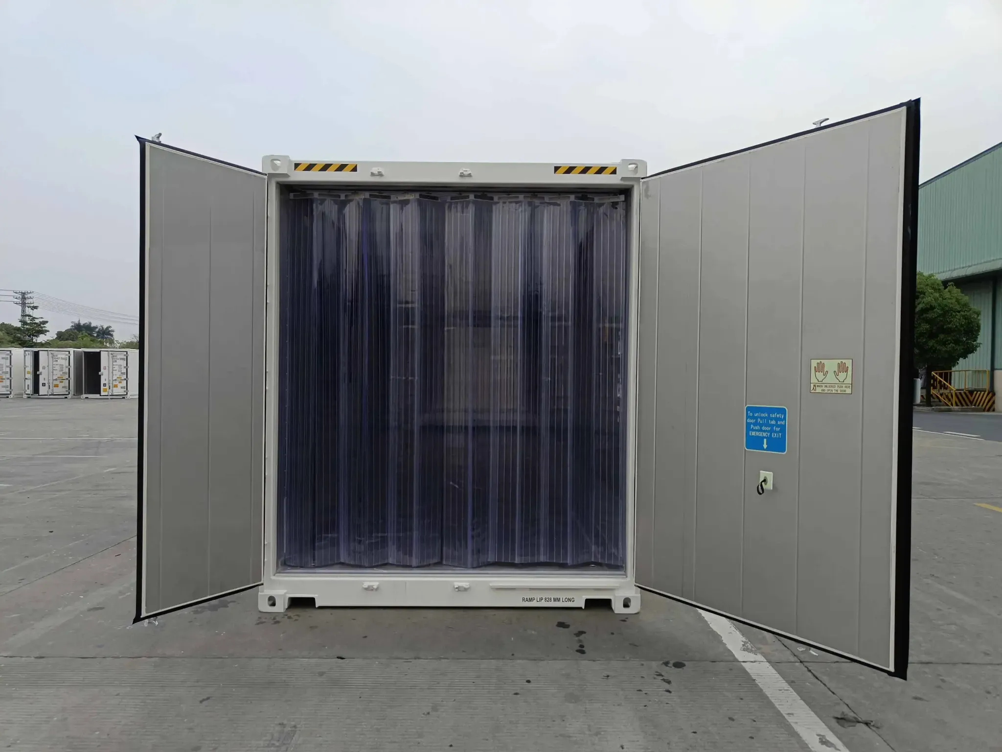 40ft new high cube refrigerated container with open doors and internal PVC strip curtain for temperature control.