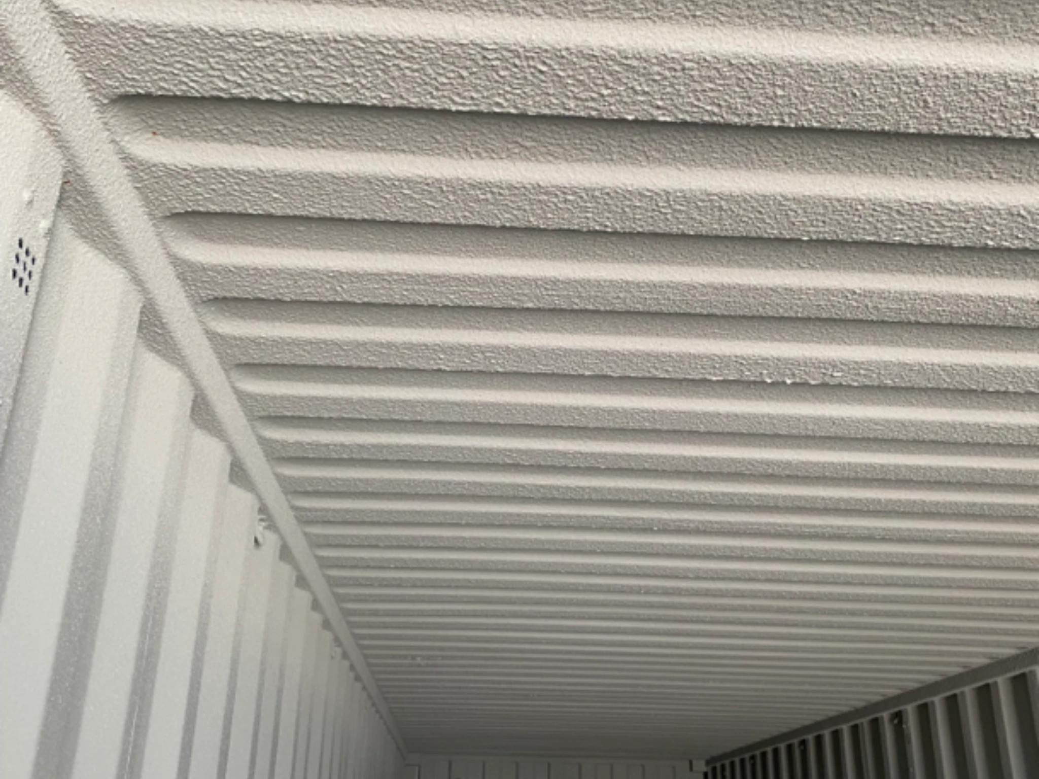 Shipping container roof interior with full Grafotherm anti condensation coating