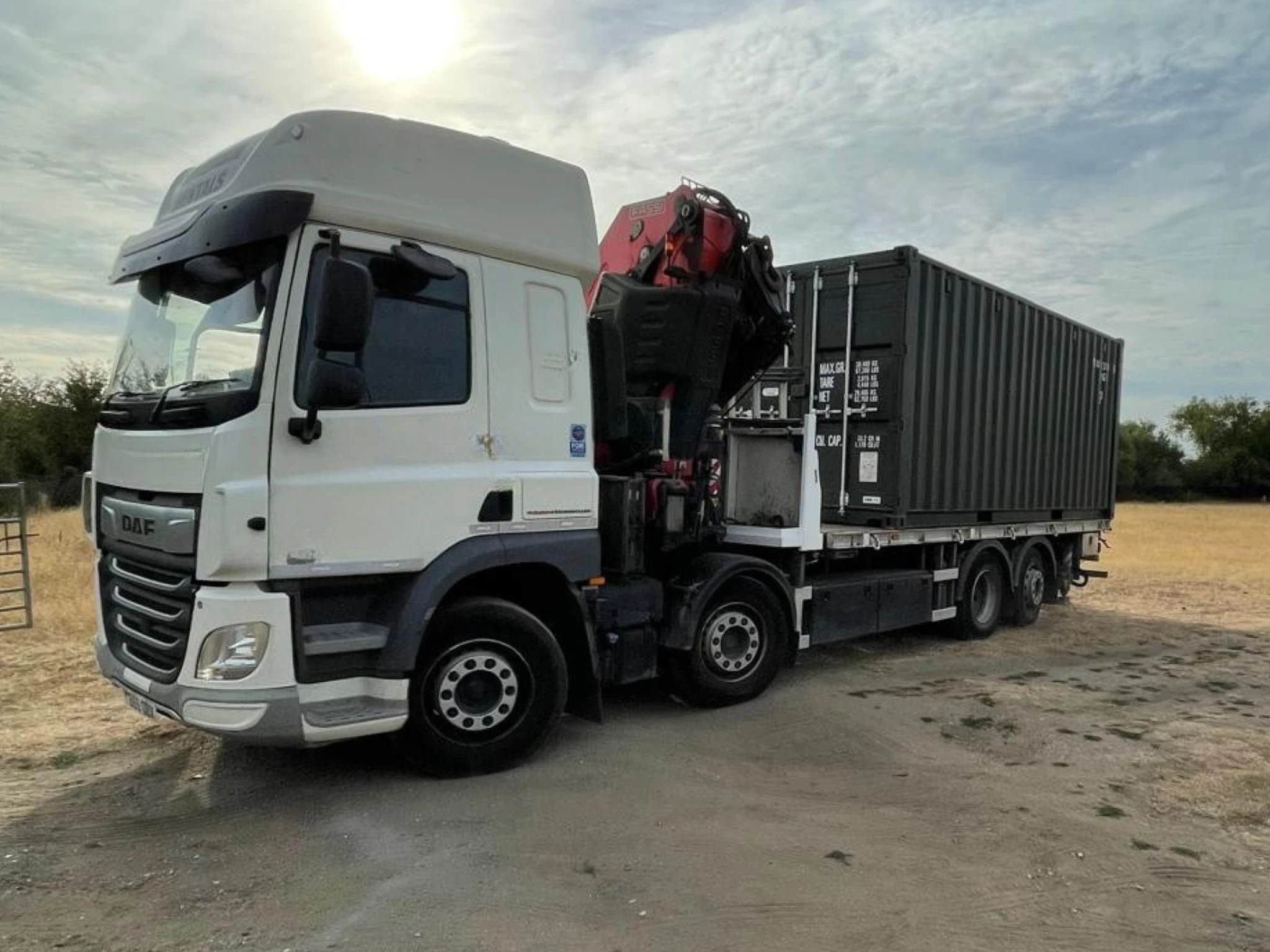 HIAB truck delivering a shipping container to site