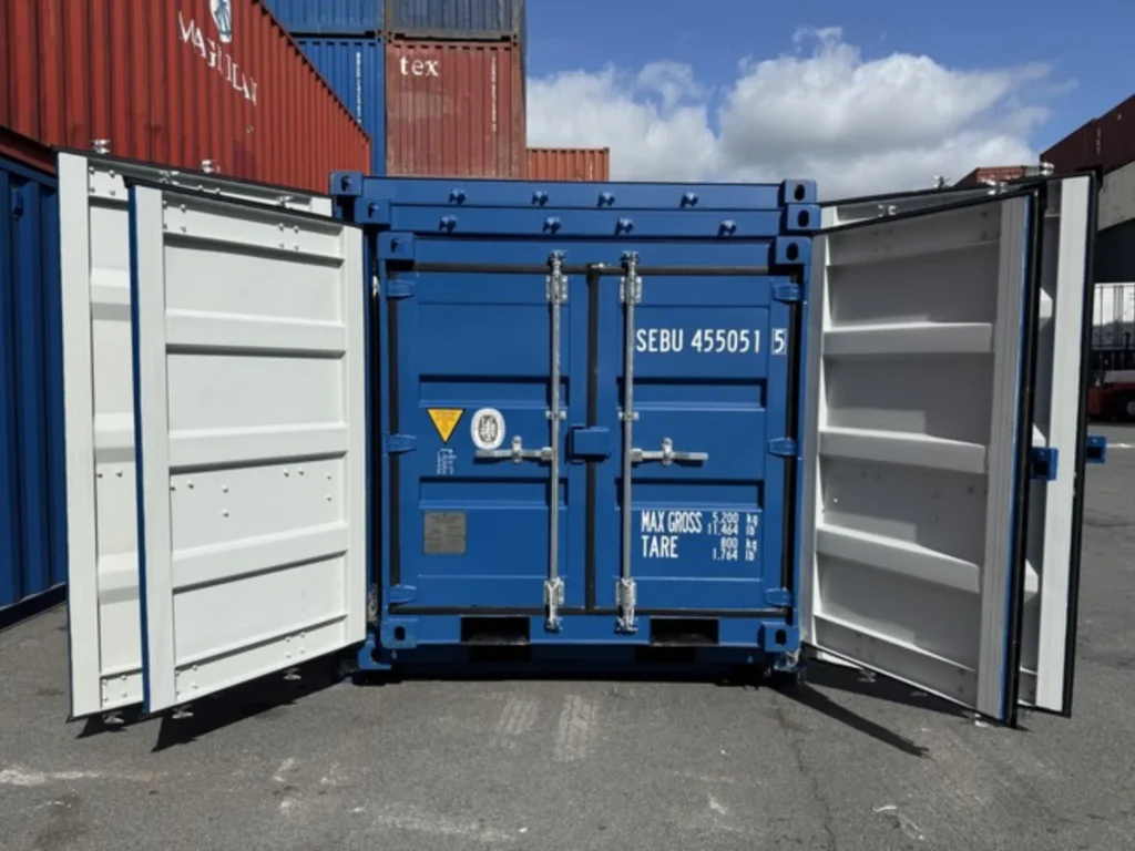Small blue shipping container UK with doors open, ideal for secure storage or site use.