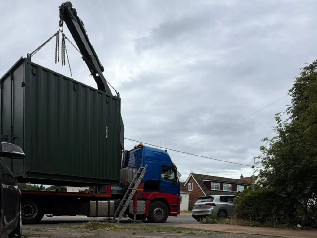 Shipping container with open doors to improve natural airflow and prevent condensation.