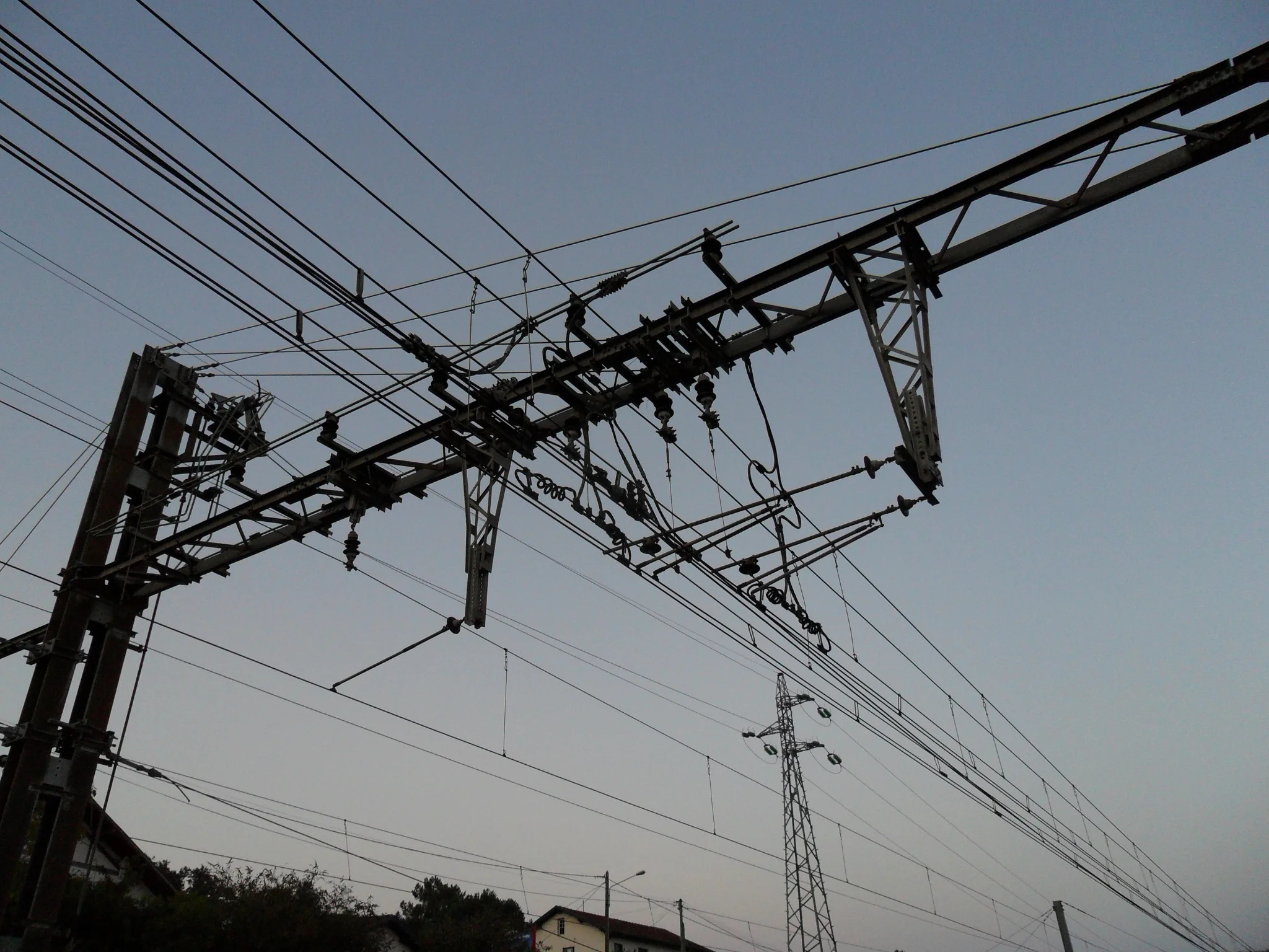 Overhead power lines above a delivery area showing a common risk for shipping container crane delivery in the UK