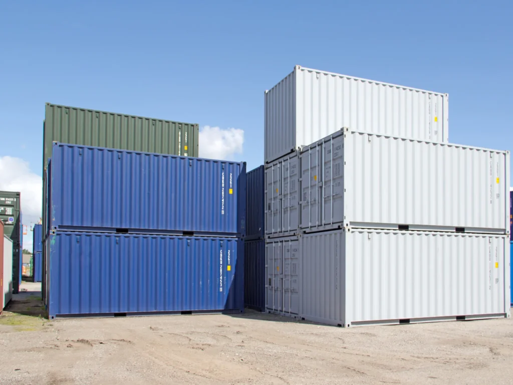 Stacked shipping containers used for secure storage solutions in the UK, suitable for farming and commercial use