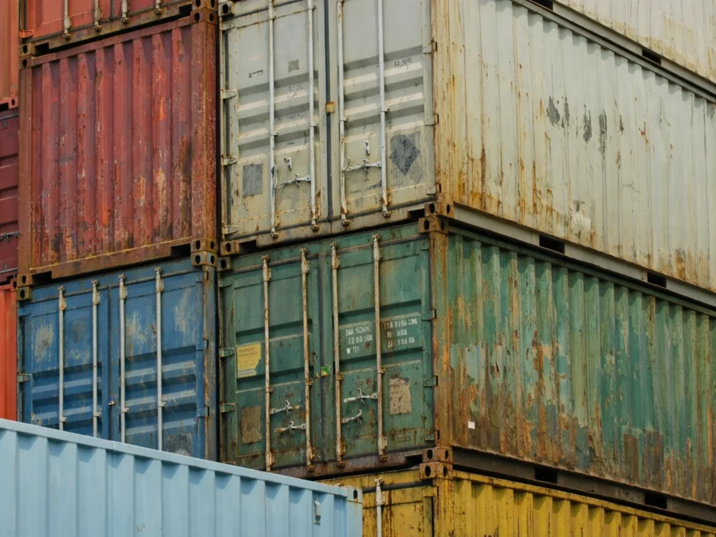 Used shipping containers stacked for long-term secure storage, commonly used on UK farms and rural sites