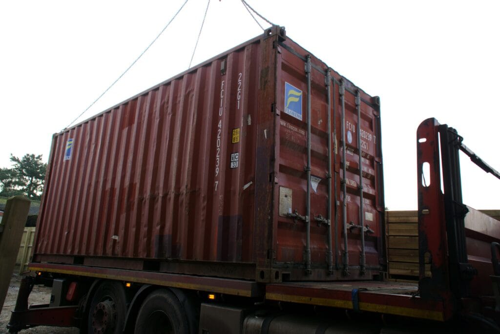 20ft Used Shipping Containers Shipping container being delivered on a hiab crane lorry