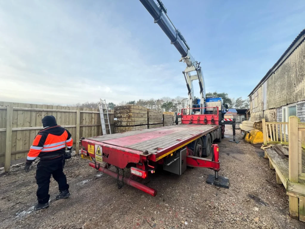 Hiab truck positioned alongside drop point ready to offload a shipping container safely