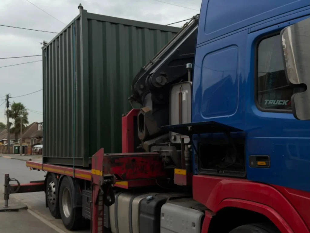 10ft green cut-down container on HIAB truck in Wickford